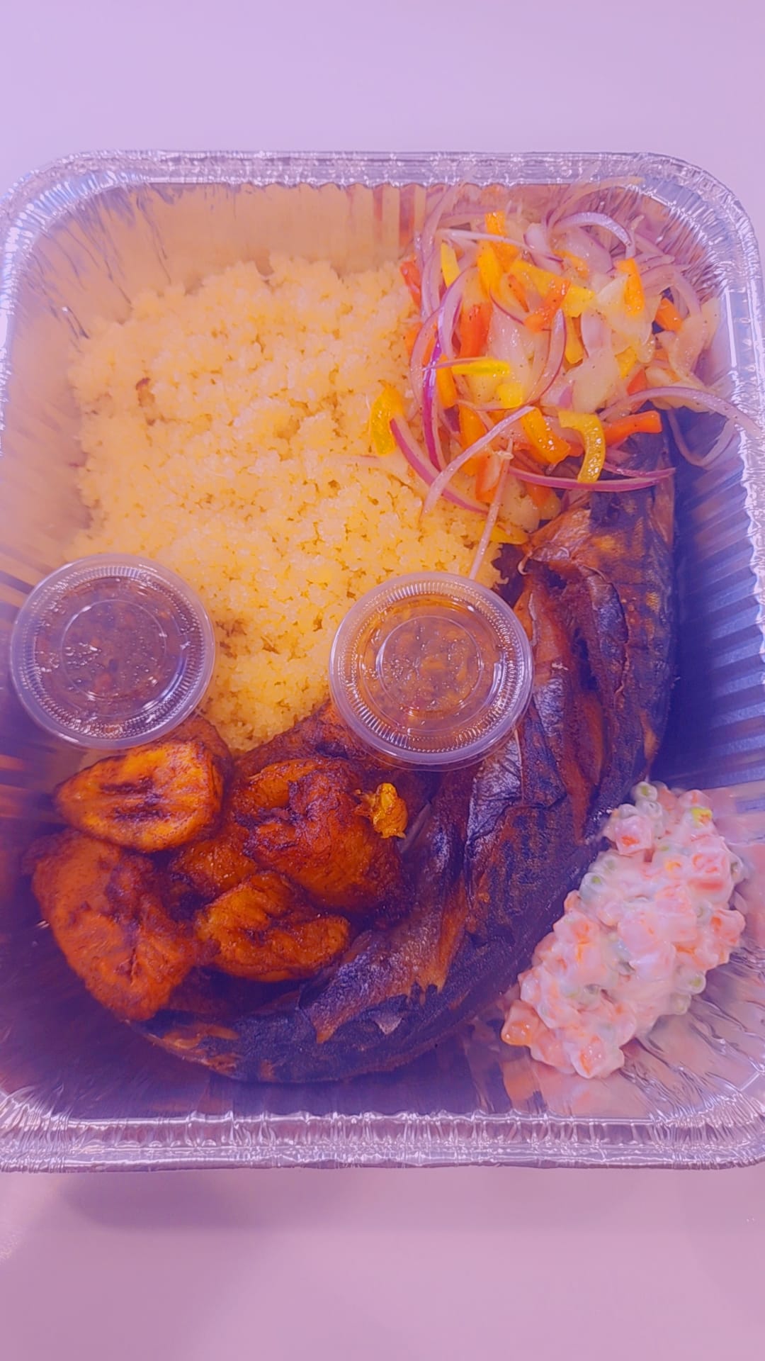 Fried fish with attieke, plantains and salad